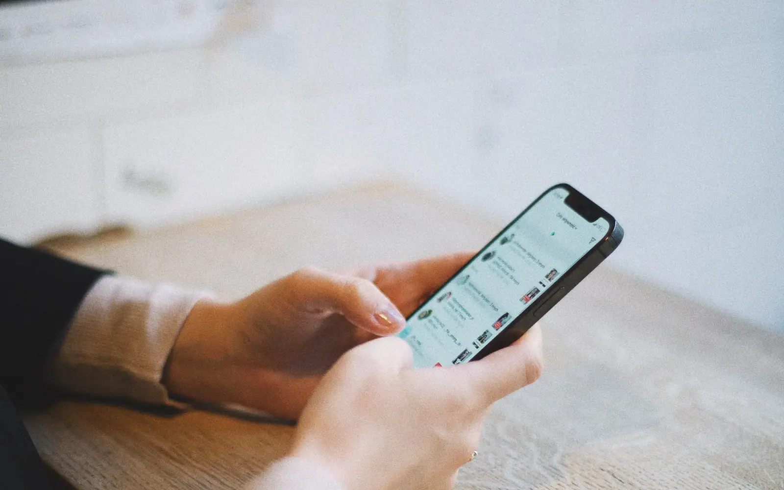 A member using a professional community application on a phone